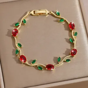 Exquisite gold plated zircon rose vine bracelet with stunning red and green stones detail.