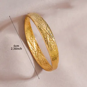 Gold stainless steel cuff bracelet with textured geometric design for women chic style.