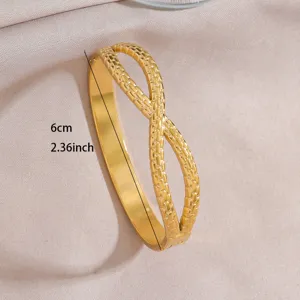 Golden stainless steel geometric open bangle bracelet with 6cm dimension detail for women fashion.