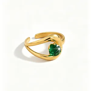 Close-up detail of the 18k gold plated stainless steel ring featuring a sparkling green zircon.