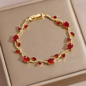 Gold plated vine bracelet featuring sparkling red zircon stones, elegant and luxury wrist jewelry.