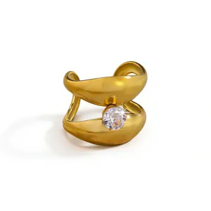 Close-up detail of the elegant double-band gold ring showcasing a sparkling cubic zirconia stone.