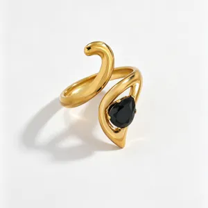 Detailed closeup of an 18k gold plated stainless steel fashion ring featuring a stylish black stone.