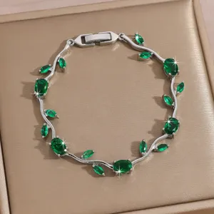 Exquisite silver-tone green stone vine bracelet, elegant lightweight luxury jewelry for women.