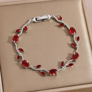 Elegant silver vine bracelet with red zircon leaves, luxury jewelry gift for women.