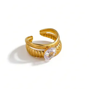 Gold stainless steel double band open ring detail featuring sparkling oval zircon stone.