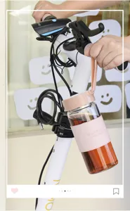 Portable glass water bottle with pink protective sleeve and handy strap for daily use.