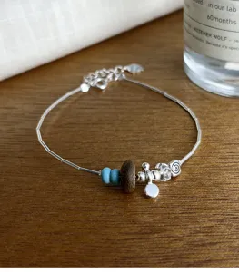 Elegantes S925 Silberarmband mit Türkis, Adlerholz und Kristallperlen im Detail