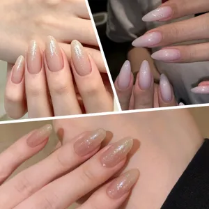 Close-up detail of almond-shaped nails with high-shine glitter top coat in nude tones.