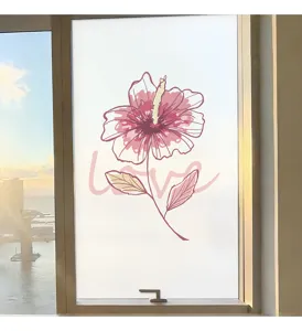 Frosted privacy window film featuring a delicate pink flower and "love" script.