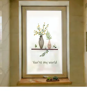 Détail d'un film de fenêtre dépoli avec motif de vase à fleurs et texte You're my world