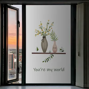 Détail d'un film de fenêtre givré avec motif floral de dessin animé et texte You're my world