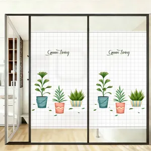 Detail of frosted window privacy film with cartoon plant patterns on a glass door.