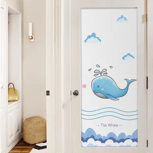 Detail of decorative frosted privacy window film with a cute cartoon blue whale design