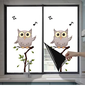 Macro view of cartoon owl patterned window privacy film showing its opaque black backing material