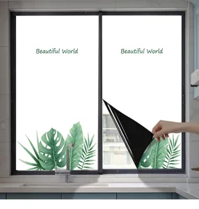 Detail view showing a hand peeling back the monstera leaf pattern frosted privacy window film
