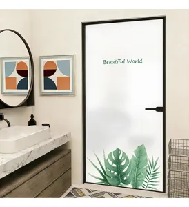 Frosted privacy glass sticker with tropical leaf design applied to a bathroom door