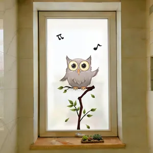 Frosted bathroom window privacy film featuring a cute cartoon owl and musical notes