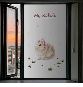 Detail view of frosted window film featuring a cartoon rabbit for privacy and decor