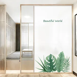 Frosted glass window film with green leaf pattern and Beautiful World text for privacy
