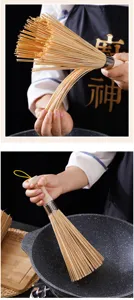 Traditional bamboo pot brush with wooden handle for kitchen cleaning, eco-friendly pan scrubber.