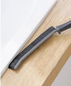 Long handle crevice cleaning brush detail view for bathroom tile gaps and window grooves.