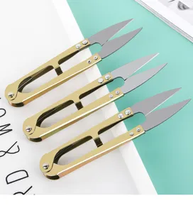 Gold U-shaped spring yarn scissors thread snips for sewing cross stitch tailoring craft tools.