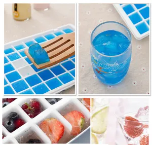 Plastic ice cube tray mold detail view showing blue ice cubes and frozen fruit cubes.