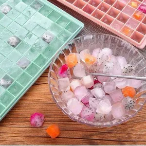 Silicone ice cube tray with lid and storage bin, perfect for making fruit ice cubes easily.