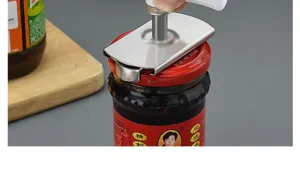 Stainless steel jar opener detail view, ergonomic lid remover for easy kitchen bottle opening.
