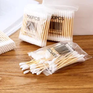 Disposable double-headed cotton swabs with wooden sticks, 100pcs per pack for daily use.