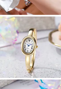 Vista detallada de cerca de un elegante reloj de pulsera ovalado dorado con números romanos