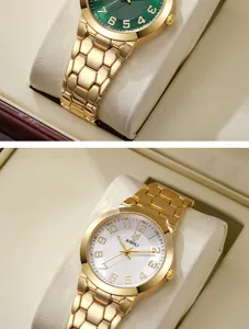 Dettaglio di orologi al quarzo dorati alla moda con quadranti strutturati verdi e bianchi