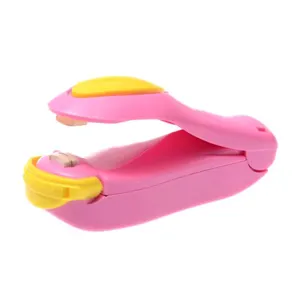 Mini portable heat sealing machine for plastic food bags, household handheld bag sealer.