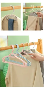 Plastic clothes hangers for home use, non-slip seamless design with hooks and clips for daily wardrobe organization.