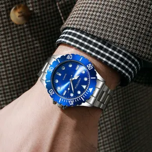 High-end business men's quartz watch with blue dial and steel strap worn on wrist