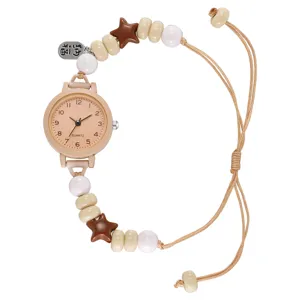 Elegante reloj de cuarzo para mujer con correa de cuerda tejida con cuentas y estrellas