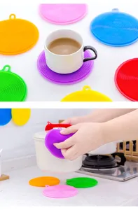 Colorful silicone dish washing sponge and heat insulation mat set for kitchen cleaning use.
