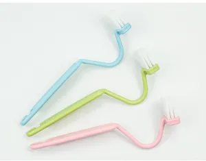 Detailed view of the S-shaped cleaning brush, perfect for toilet bowls and tight bathroom corners.
