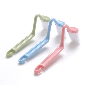 S-shaped toilet cleaning brush set with curved handle and white bristles for bathroom care.
