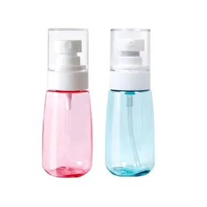 Portable clear pink and blue spray bottles set, travel cosmetic fine mist containers.