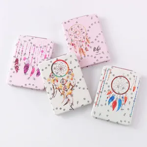 Portable folding makeup mirror with PU leather case, elegant dreamcatcher design for daily touchups.