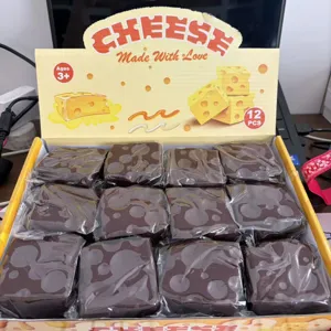 Closeup detail of 12-piece brown slow rebound cheese squeeze toy set neatly arranged in box.
