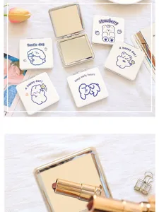 Close up details of the portable double sided folding makeup mirror with cute cartoon prints.