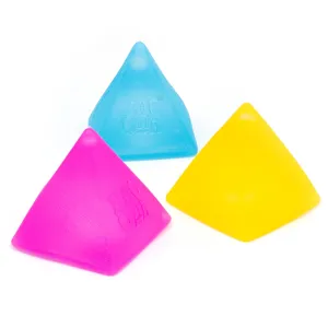 Detailed close-up view of matte pyramid fidget toys in vibrant pink, blue, and yellow colors.