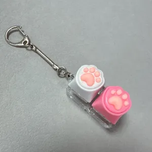 Cute cat paw mechanical keyboard switch tester keychain decompression toy portable fidget charm.