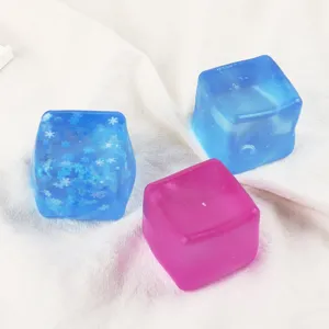 Closeup of colorful square ice cube squishy toys with snowflake glitter, soft decompressing hand toy.