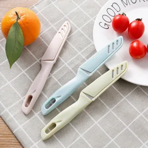 Portable fruit knife set with protective cover, colorful kitchen peeler for home vegetable use.
