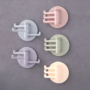 Rotatable adhesive wall hook with 3 swivel branches, punch-free pastel storage holder for home.