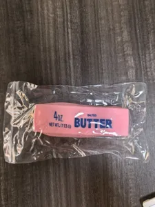 Pink butter squishy toy detail showing slow rebound texture and novelty food shape design.